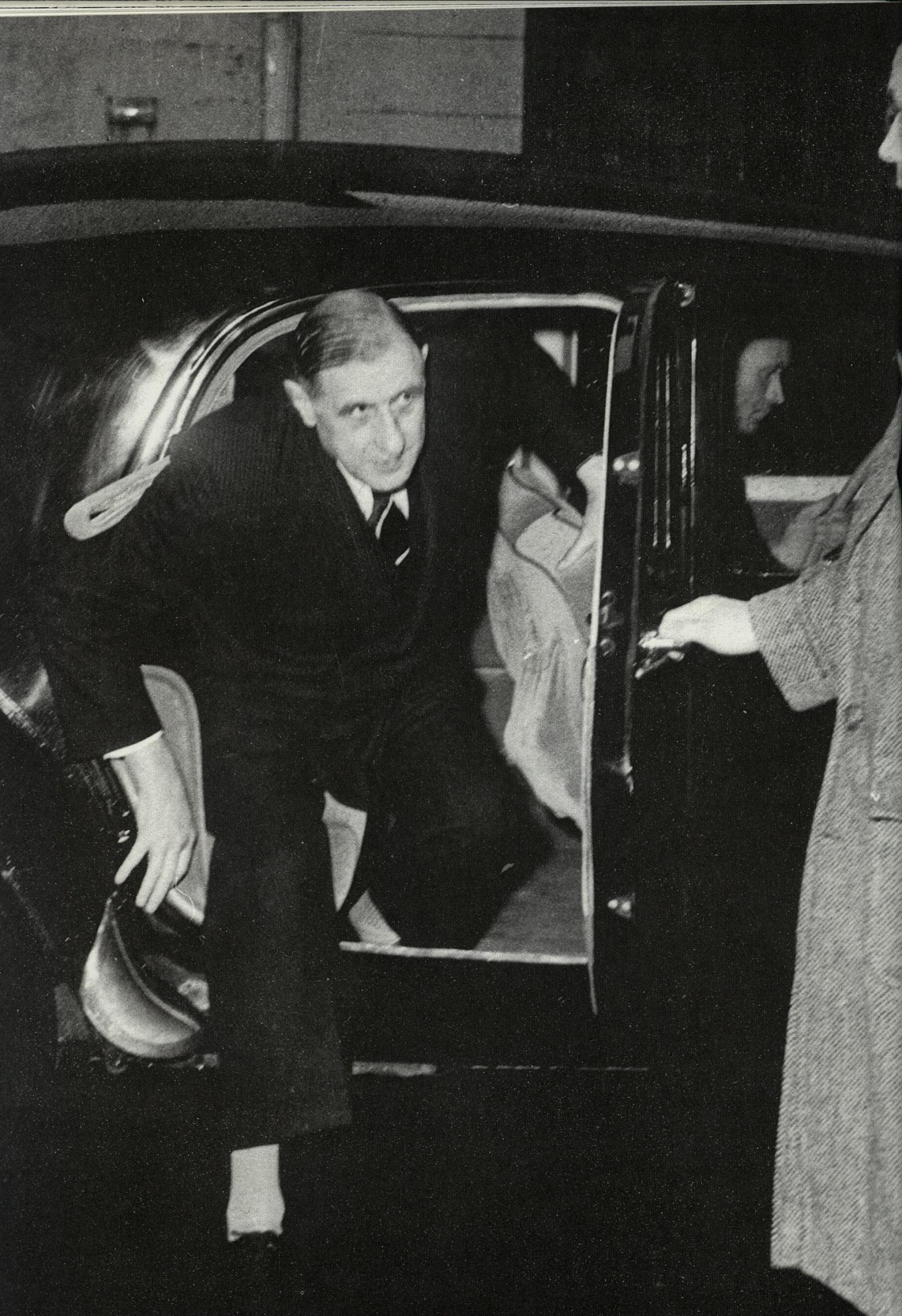 President De Gaulle out of a Citroen Traction Avant